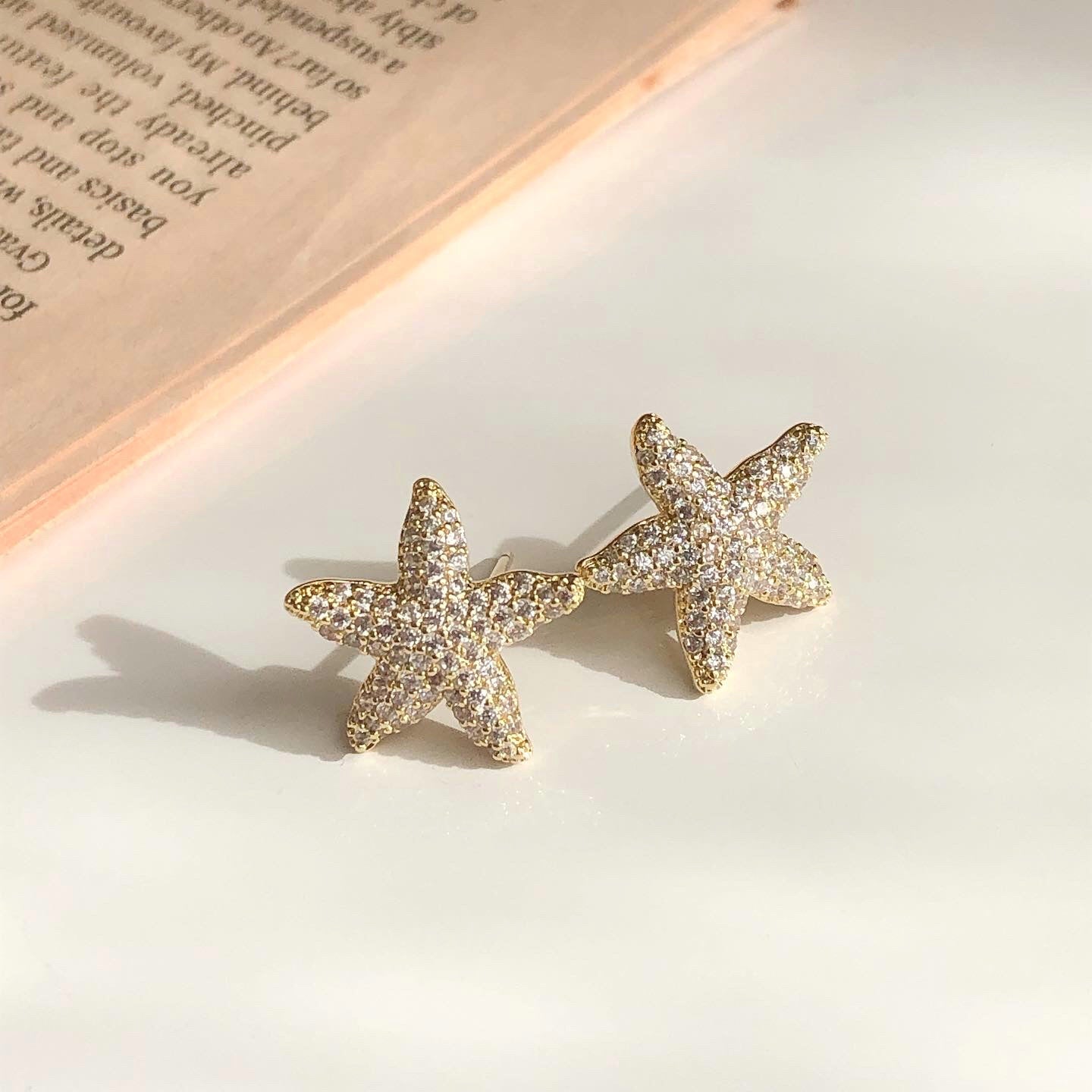 zircon starfish earrings